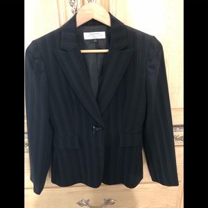 Women’s Tahari blazer.